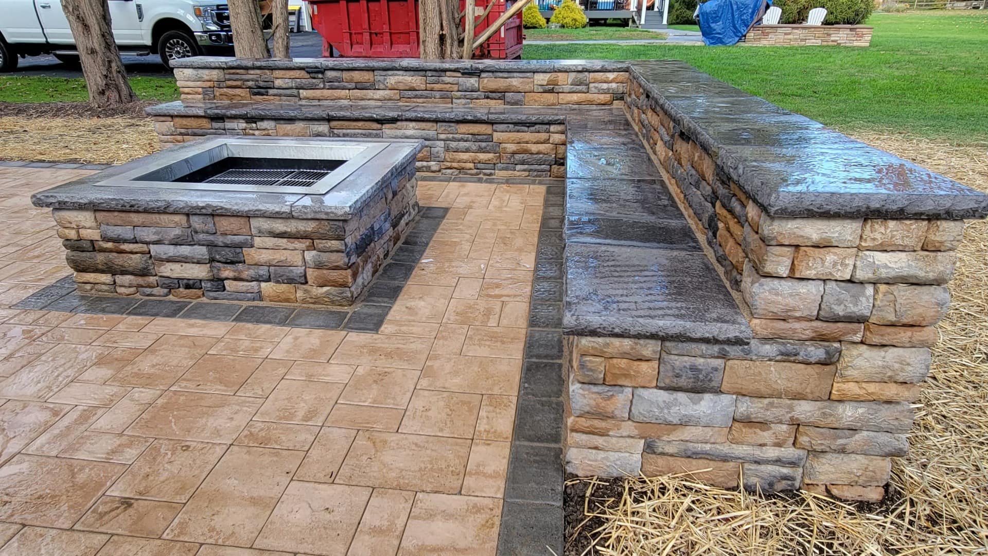 Natural stone retaining wall in a landscaped yard